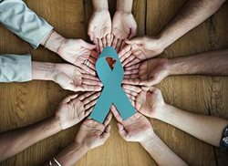 support hands with teal ribbon